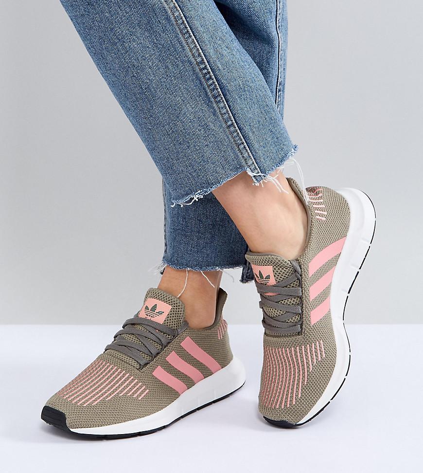 grey adidas trainers with pink stripes