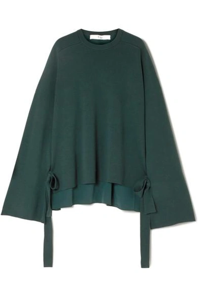 Shop Tibi Silk Crepe-paneled Merino Wool Sweater In Dark Green