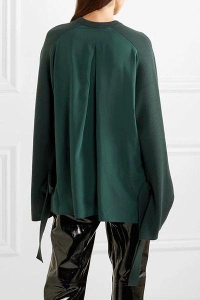 Shop Tibi Silk Crepe-paneled Merino Wool Sweater In Dark Green