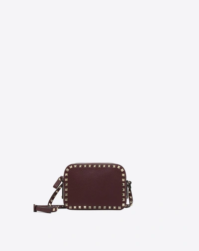 Shop Valentino Rockstud Cross Body Bag In Deep Purple