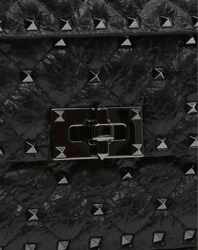 Shop Valentino Garavani Small Crinkled Lambskin Rockstud Spike Bag In Black