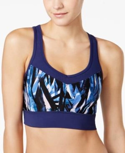 Shop Calvin Klein Performance Explosion Printed Medium-support Racerback Sports Bra In Ink Combo