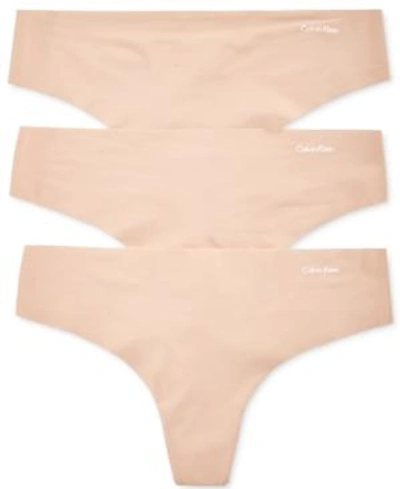 Shop Calvin Klein Women's Invisibles 3-pack Thong Underwear Qd3558 In Light Caramel