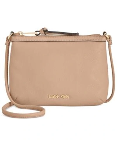 Shop Calvin Klein Carrie Pebble Leather Crossbody In Nude