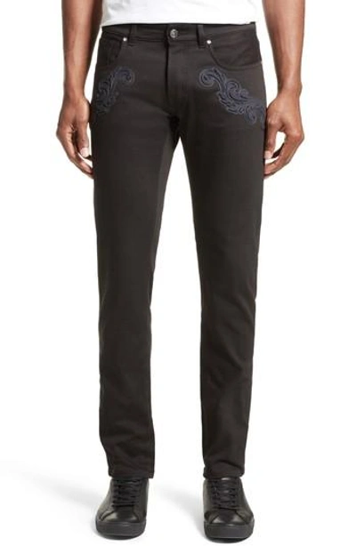 Shop Versace Baroque Patches Jeans In Black