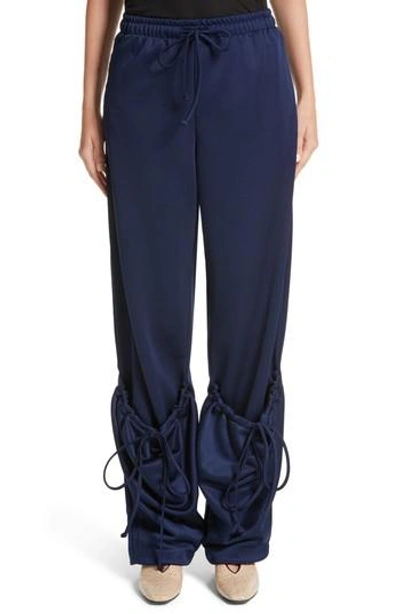 Shop Jw Anderson Jersey Pocket Hem Trousers In Midnight Blue