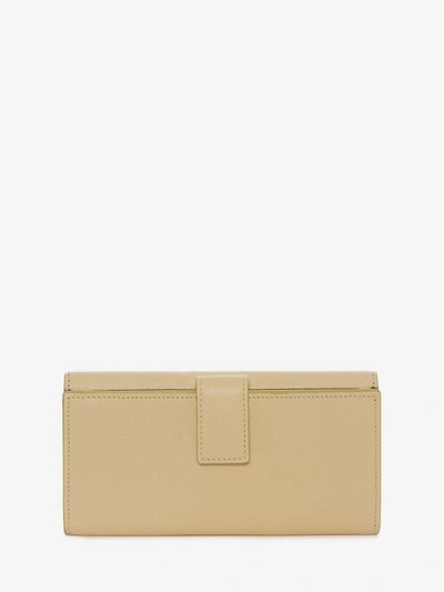Shop Alexander Mcqueen Continental Skull Leather Wallet In Butter Yellow