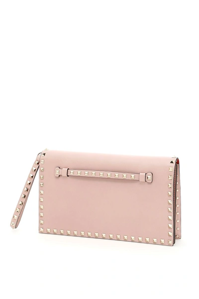 Shop Valentino Rockstud Leather Clutch In Water Roserosa