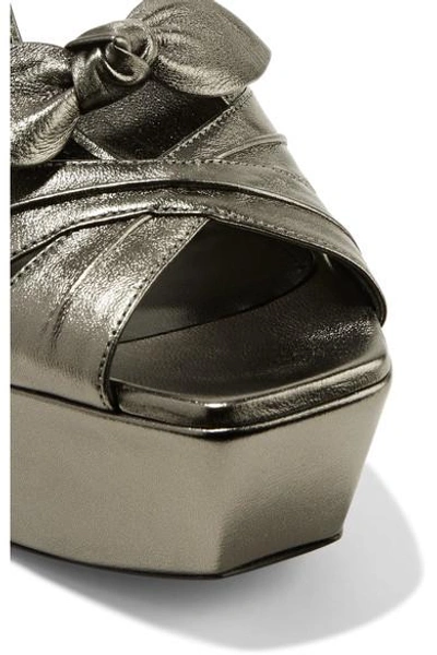 Shop Saint Laurent Farrah Bow-embellished Metallic Leather Platform Sandals In Gunmetal