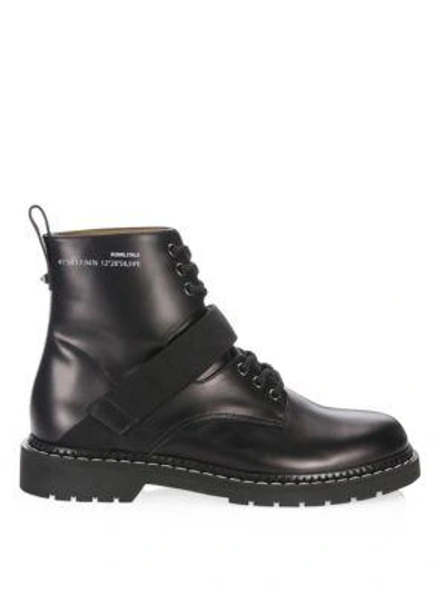 Shop Valentino Strapped Leather Combat Boots In Black White