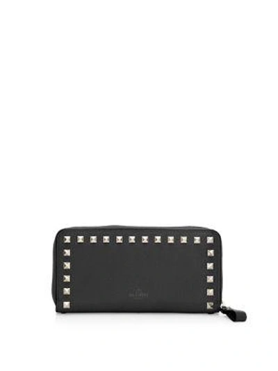 Shop Valentino Garavani Rockstud Zip-around Continental Leather Wallet In Black