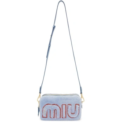 Shop Miu Miu Blue Shearling Chain Camera Bag In F0637 Astral