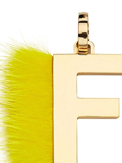 Shop Fendi Abclick F Pendant Charm In Yellow