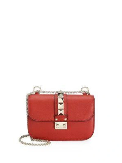 Shop Valentino Garavani Small Rocklock Leather Crossbody Bag In Red