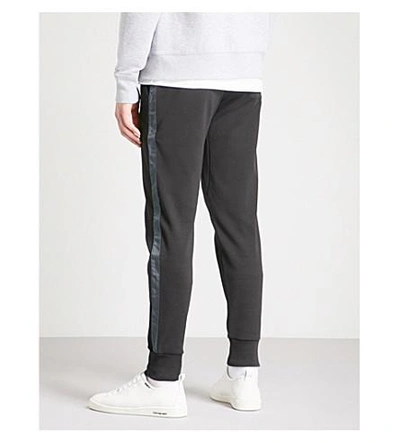 Shop Michael Kors Tape-trim Tapered Cotton-jersey Track Pants In Black