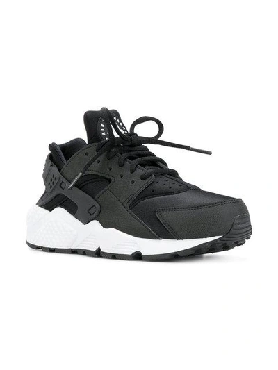 Shop Nike Air Huarache Sneakers In Black