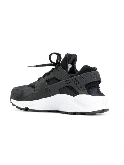 Shop Nike Air Huarache Sneakers In Black