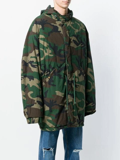 Shop Yeezy Camouflage Oversized Parka In Green