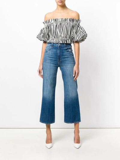 Shop J Brand Cropped Flared Jeans In Blue