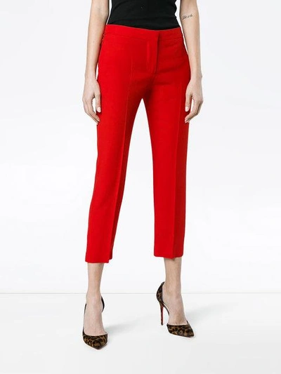 Shop Alexander Mcqueen Mid Rise Slim Fit Cropped Trousers - Red