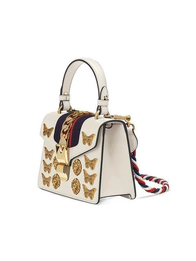 Shop Gucci Sylvie Animal Studs Leather Mini Bag - White
