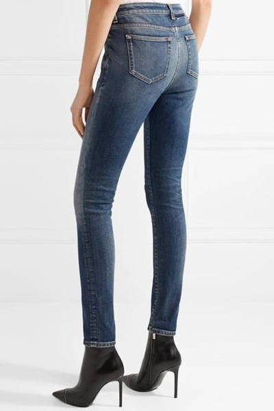 Shop Saint Laurent Distressed Mid-rise Skinny Jeans In Mid Denim