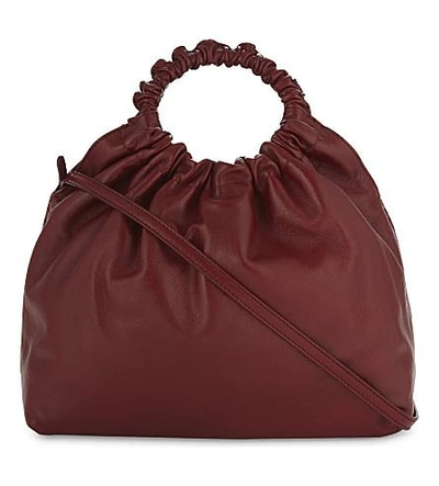 Shop The Row Circle Leather Cross-body Bag In Deep Rouge Pebbled
