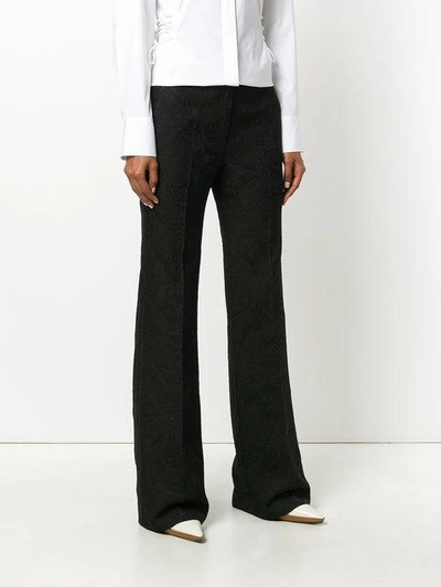 Shop Theory Flared Jacquard Trousers In Black