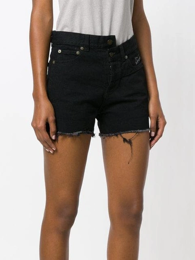 Shop Saint Laurent Asymmetric Denim Shorts In Black