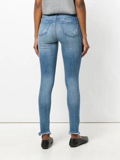 Shop J Brand Distressed Skinny Jeans In Blue