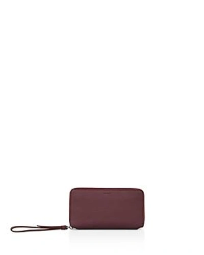 Shop Allsaints Fetch Leather Phone Wristlet In Burgundy Red/silver