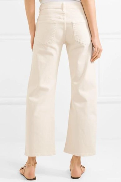 Shop Khaite Wendall Cropped Mid-rise Flared Jeans
