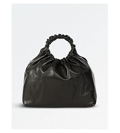 Shop The Row Circle Leather Cross-body Bag In Black Pebbled