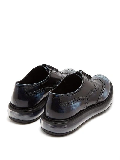 Prada Levitate Burnished-leather Wingtip Brogues In Navy-blue | ModeSens