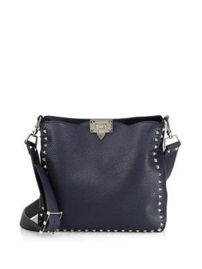Shop Valentino Rockstud Small Leather Hobo Bag In Marine