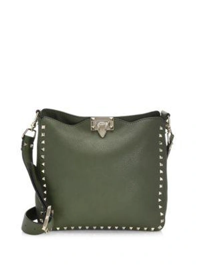 Shop Valentino Rockstud Small Leather Hobo Bag In Marine