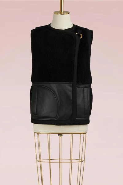 Shop Chloé Sleeveless Shearling Coat In Black