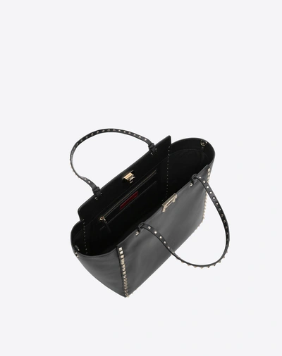 Shop Valentino Garavani Medium Rockstud Bag In Black