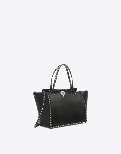 Shop Valentino Garavani Medium Rockstud Bag In Black