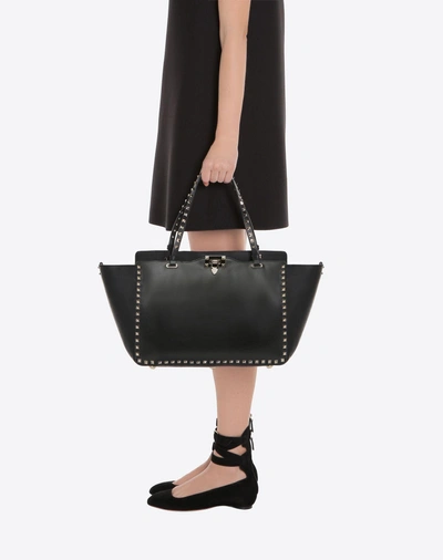 Shop Valentino Garavani Medium Rockstud Bag In Black