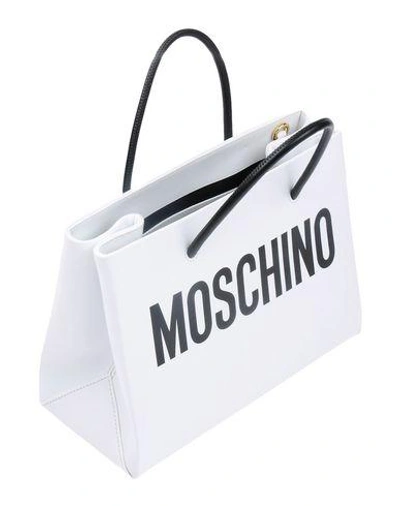 Shop Moschino Handbags In White