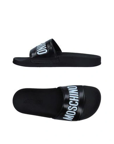 Shop Moschino Sandals In Black