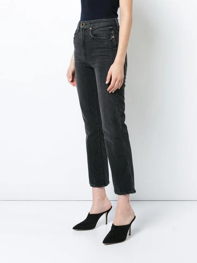 Shop Khaite Cropped Flared Jeans In Black