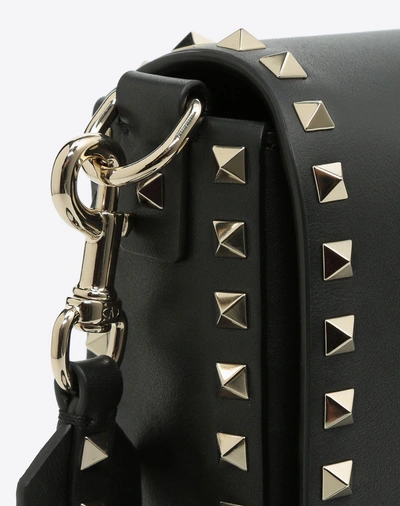 Shop Valentino Rockstud Crossbody Bag In Black