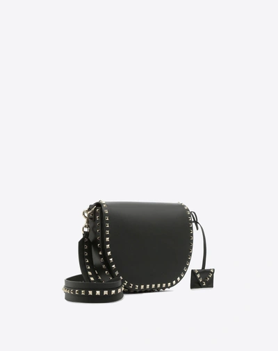 Shop Valentino Rockstud Crossbody Bag In Black