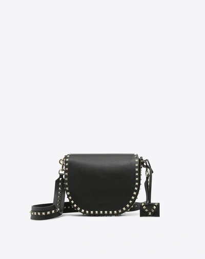 Shop Valentino Rockstud Crossbody Bag In Black