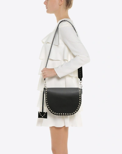 Shop Valentino Rockstud Crossbody Bag In Black