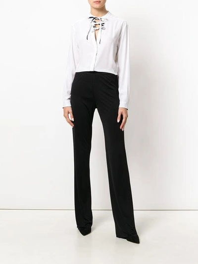 Shop Emilio Pucci Flared High-rise Trousers In Black