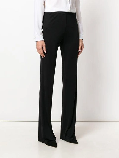 Shop Emilio Pucci Flared High-rise Trousers In Black