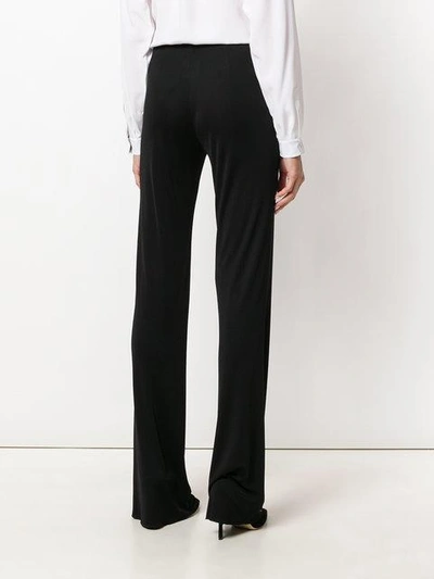 Shop Emilio Pucci Flared High-rise Trousers In Black